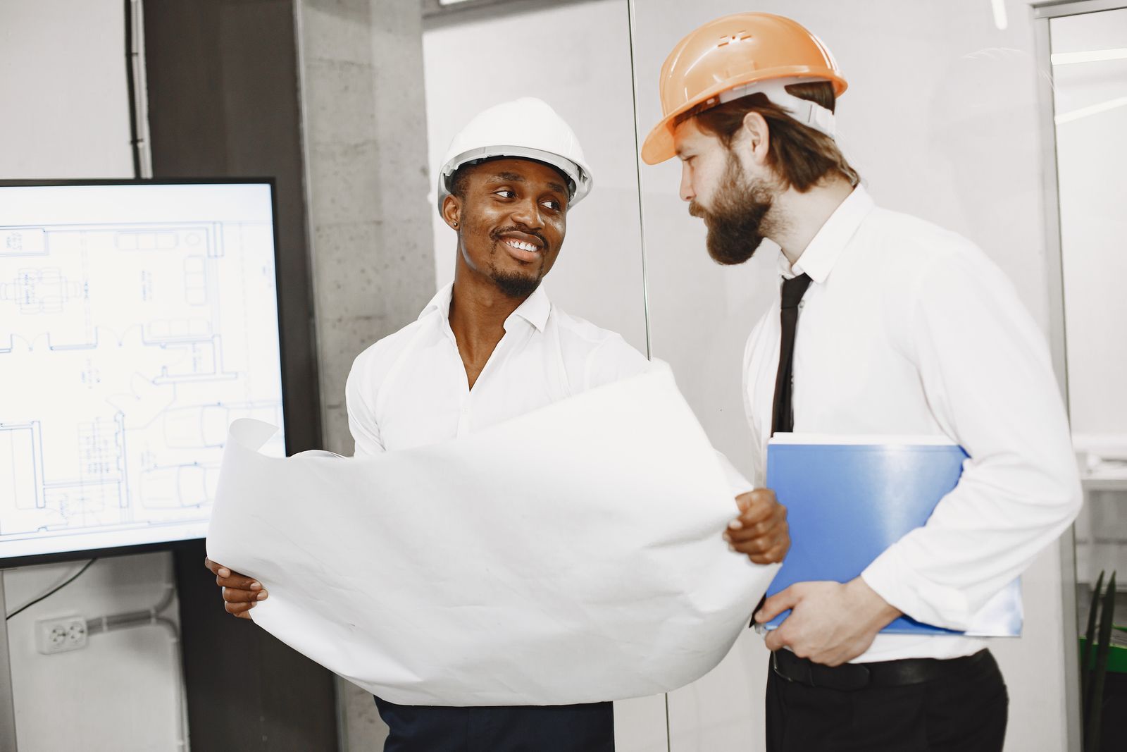 Construction professionals reviewing plans to determine an approval pathway