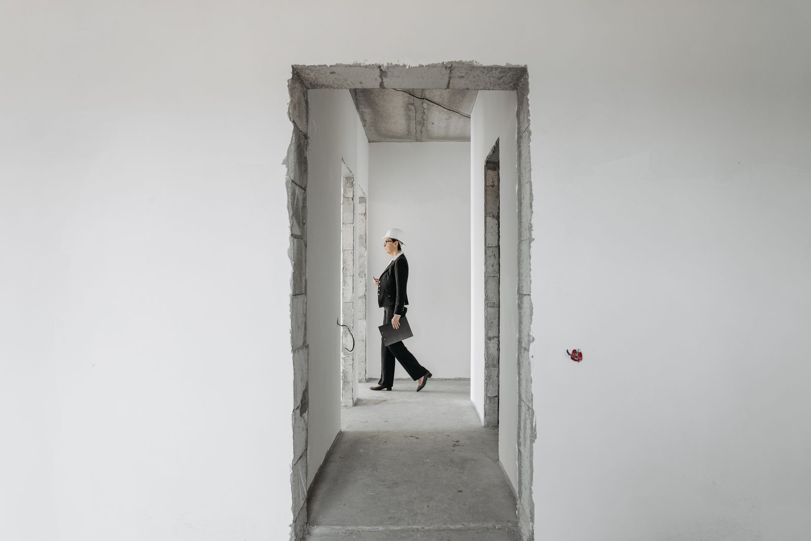 Property professional inspecting an unfinished development site