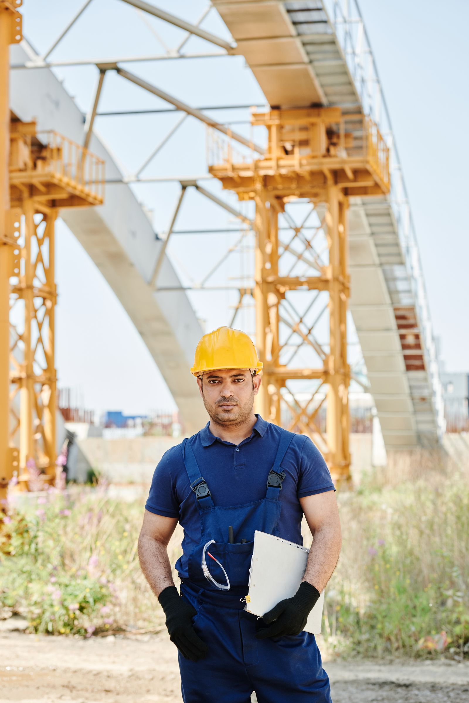 Construction specialist reviewing project documents on site