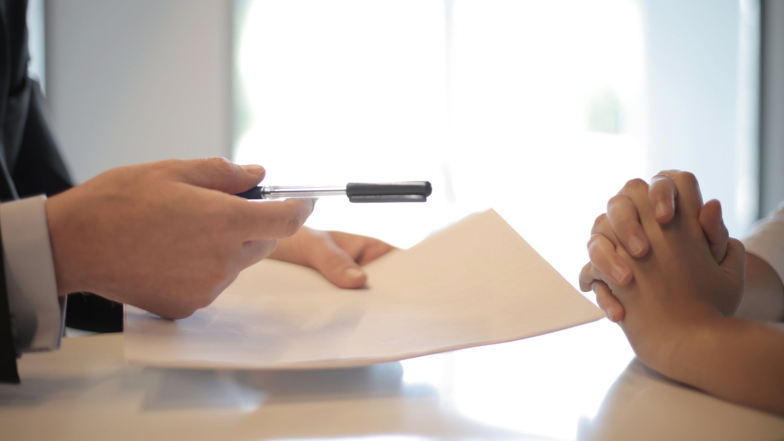 Business partners discussing and signing an agreement