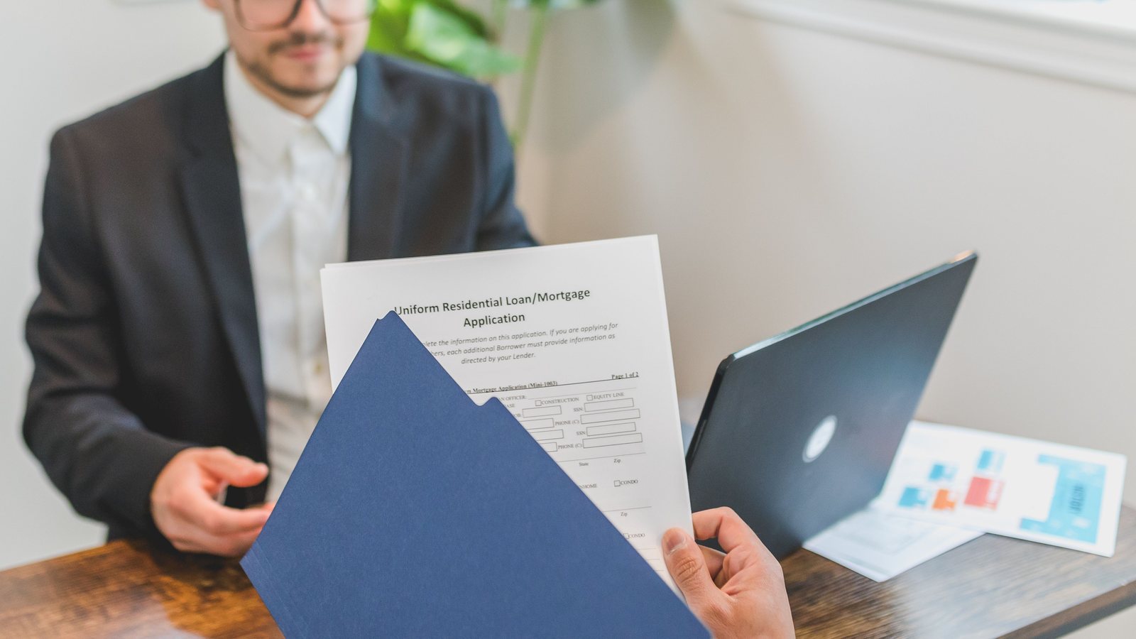 Joint venture partners reviewing finance obligations with an adviser